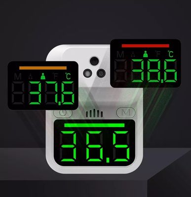 Non contatti l'istante infrarosso fissato al muro della fronte del termometro della temperatura del LED Digital che legge l'esposizione